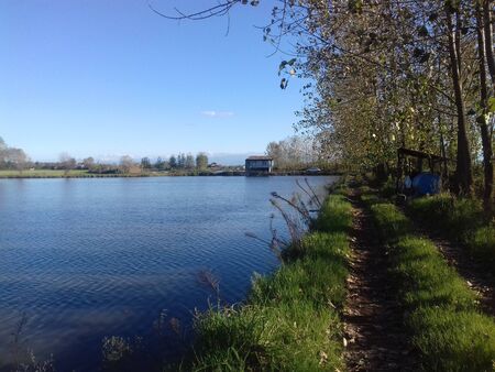 A house by the water. A beautiful and quiet place to relax outside the city on a holiday in october. A beautiful region of the village next to the lake, Iran, Gilan.の写真素材