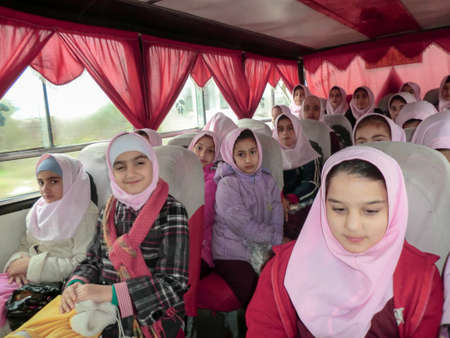 Elementary school services for girls. An Islamic school where girls should wear scarves and dress uniforms. Girl students in school service.のeditorial素材