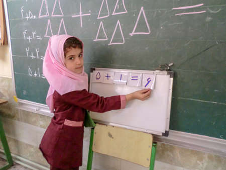 One of the primary school girls in Rasht, Guilan province, Iran. An Islamic school where girls should wear scarves and dress uniformsのeditorial素材