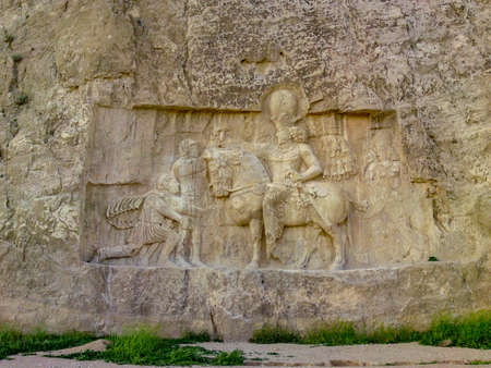 Shiraz, PERSEPOLIS, Naqsh-e Rustam, Iran. Bas-relief of the Persian Empire. Rock relief of the triumph of Shapur I over the Roman emperors Valerian and Philip the Arab. Ancient city Persepolis- one of UNESCO World Heritage Sites.のeditorial素材