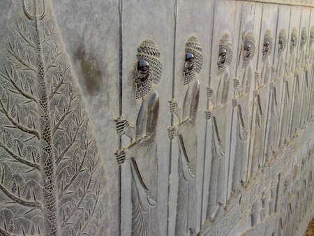 Bas-relief depicts guards - warriors of king. Ancient relief on the wall of the ruined city of...