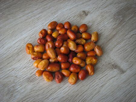 Dried fruit of Oleaster, Persian olive, Russian olive, silver berry, oleaster, or wild olive . Heap of dried fresh organic fruit of the Oleaster on wooden background. close upの写真素材