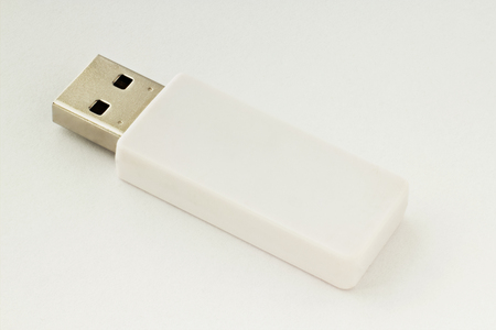 White usb flash drive on white background for design.の写真素材