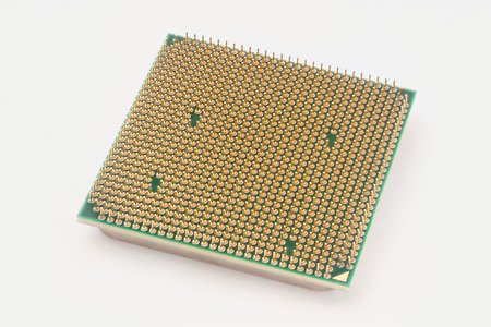 Processor isolated on white background. With gold-plated contacts.の写真素材