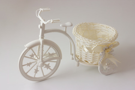 Plastic bicycle with a basket for flowers.の写真素材