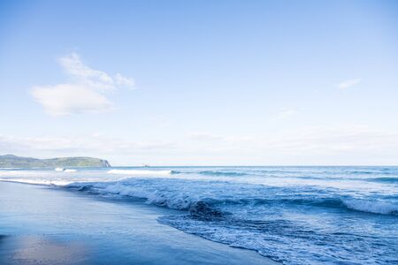 Wild beach made of volcanic sand on the Pacific Ocean, Kamchatka Peninsula, Russia.の写真素材