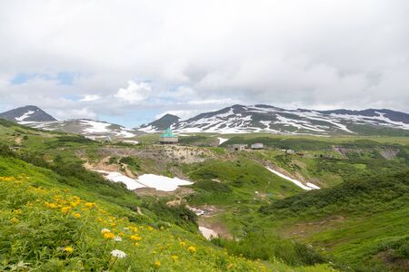 Small Valley of Geysers, Kamchatka Peninsula, Russia. This is a unique active fumarole field, the hot gases of which pass through the water of a cold stream, heating it and creating a gushing effect.の写真素材