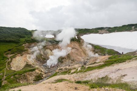 Small Valley of Geysers, Kamchatka Peninsula, Russia. This is a unique active fumarole field, the hot gases of which pass through the water of a cold stream, heating it and creating a gushing effect.の写真素材