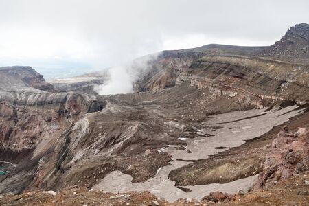 Gorely Volcano, Kamchatka Peninsula, Russia. An active volcano located in the south of Kamchatka. It consists of 11 cones and about 30 craters. Some craters are filled with acid or fresh water.の写真素材
