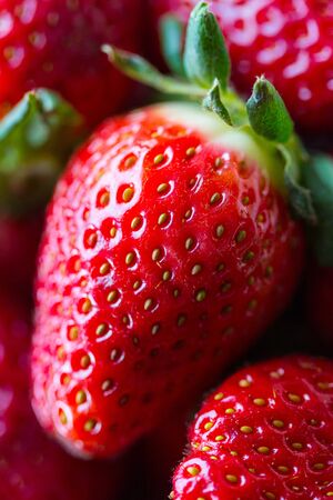Ripe sweet fresh red strawberries closeup. Harvesting. Juicy berries and fruits. Healthy eating Seasonal Vitamins. Diet dessert. Tasty food.の写真素材