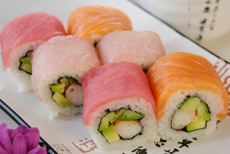 Sushi rolls, on a plate with hieroglyphicsのeditorial素材