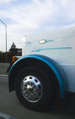 Detail of a tire of a truck running on a freewayの写真素材