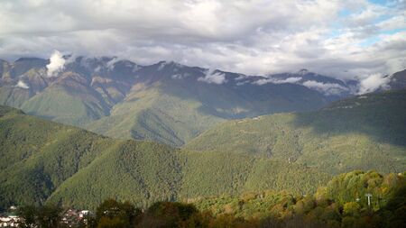 Beautiful mountains in the fall. Autumn at Rosa Khutor in Sochi. Mountains in autumn aerial view. Beautiful foliage colors with aerial view.の写真素材