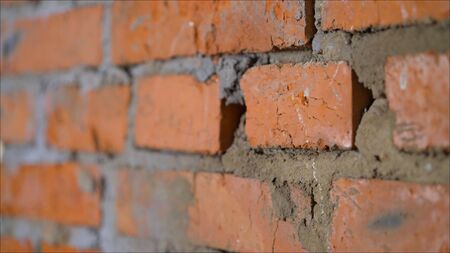 wall of bright old red brick as beautiful loft-style background for modern interior design and...