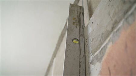 Wall alignment with a special tool. Alignment of walls in the repair with the help of a special...