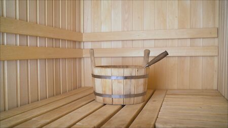 Worker using mortar to level floor in room. Construction worker lays the tile in the apartment building using special tools alone. Level the floor.の写真素材
