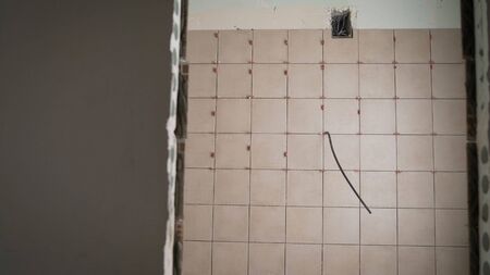 Tiles in the bathroom. Laying ceramic tiles. Ceramic wall tileの写真素材