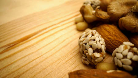 Nuts on a wooden background. close-up and selective focus. Nuts on a table close-up.の写真素材
