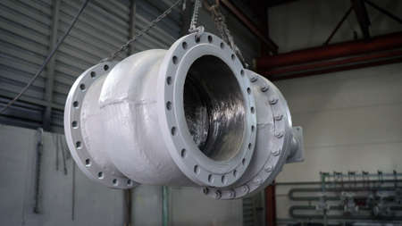 Large metal hydraulic valve for painting. Metal valve, in a metal factory.の写真素材
