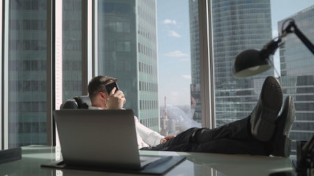 Worker smears concrete floor with water for processing. Waterproofing concrete floor. The worker makes a preliminary step before waterproofing the floor.の写真素材