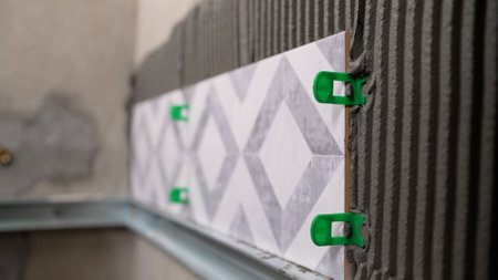 The process of laying tiles. Construction, renovation, apartment renovation. The master glues...