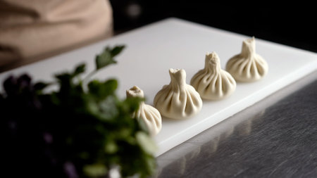 Sculpting large khinkali. Georgian cuisine, khinkali. khinkali prepared raw meat and dough, to National Georgian dish.の写真素材