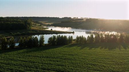 Beautiful landscape in summer, lake at dawn with fog. Aerial drone of a beautiful valley with lakes. Sunrise golden hour wonderful inspiring natural landscape.の写真素材