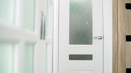 Beautiful white door in the interior of a door sales salon. Door salon. White interior door.の写真素材