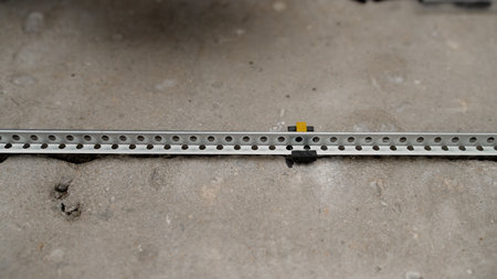 Metal beacons for floor repairs. Repair of floors, installation of guides for concrete screeds....