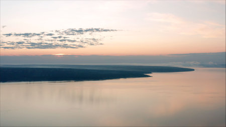 Sunset over the reservoir frames. Beautiful, bright sunrise over the lake.の写真素材