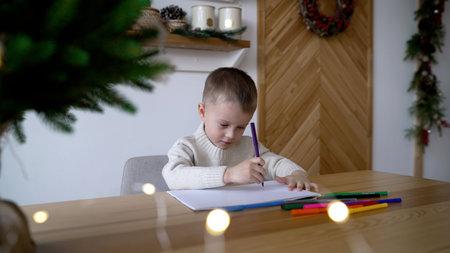 Child carefully writing heartfelt letter to Santa near glowing Christmas tree, capturing childhood...