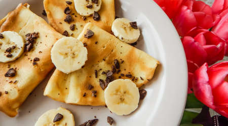 pancakes with slices of banana and chocolate, carnivalの写真素材