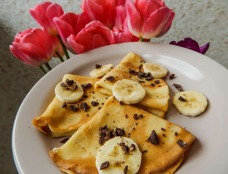pancakes with slices of banana and chocolate, carnivalの写真素材