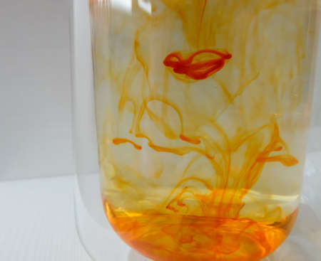 water in a glass colored with manganese, beautiful patternsの写真素材