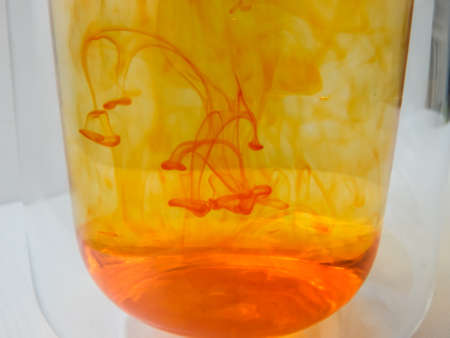 water in a glass colored with manganese, beautiful patternsの写真素材