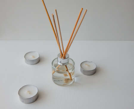 aroma with wooden sticks and candlesの写真素材