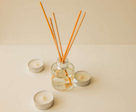 aroma with wooden sticks and candlesの写真素材