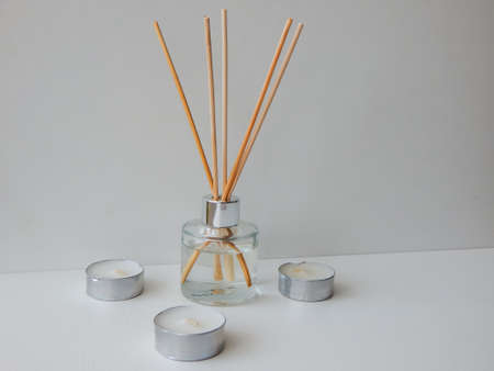 aroma with wooden sticks and candlesの写真素材