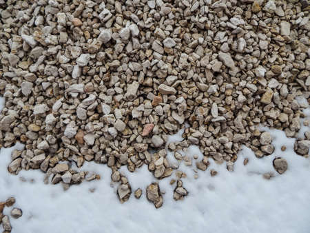 limestone stone lies in the snowの写真素材