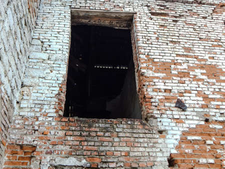 an old abandoned building built in 1957, from the window a chimney for the stove