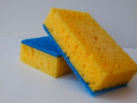 dishwashing sponge, yellow and blueの写真素材
