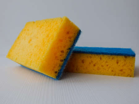 dishwashing sponge, yellow and blueの写真素材