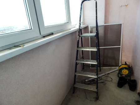 repair on the balcony, stairs and toolsの写真素材