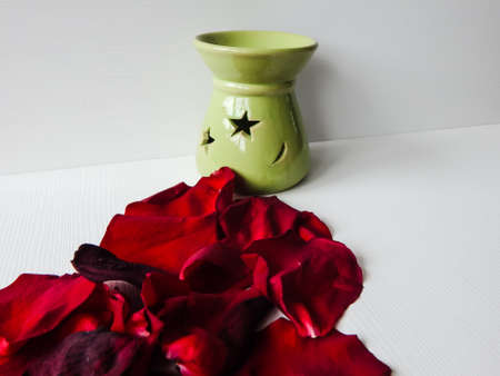 rose petals and candlestick with starの写真素材