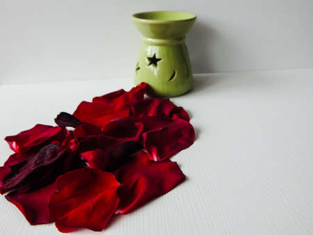 rose petals and candlestick with starの写真素材