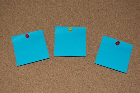 Blue Post it Notes on a Cork Boardの写真素材