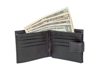 United States One, Five, Ten and Twenty Dollar bills in a black wallet. Isolated on a white...