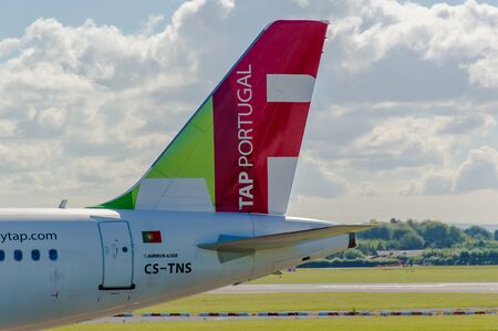 MANCHESTER, UNITED KINGDOM - AUG 07, 2015: Air Portugal TAP Airbus A320 tail livery at Manchester Airport Aug 07 2015.のeditorial素材