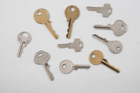 Assortment of keys on plain backgroundの写真素材