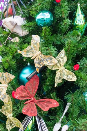 A closeup of a Christmas tree showing some decorationsの写真素材